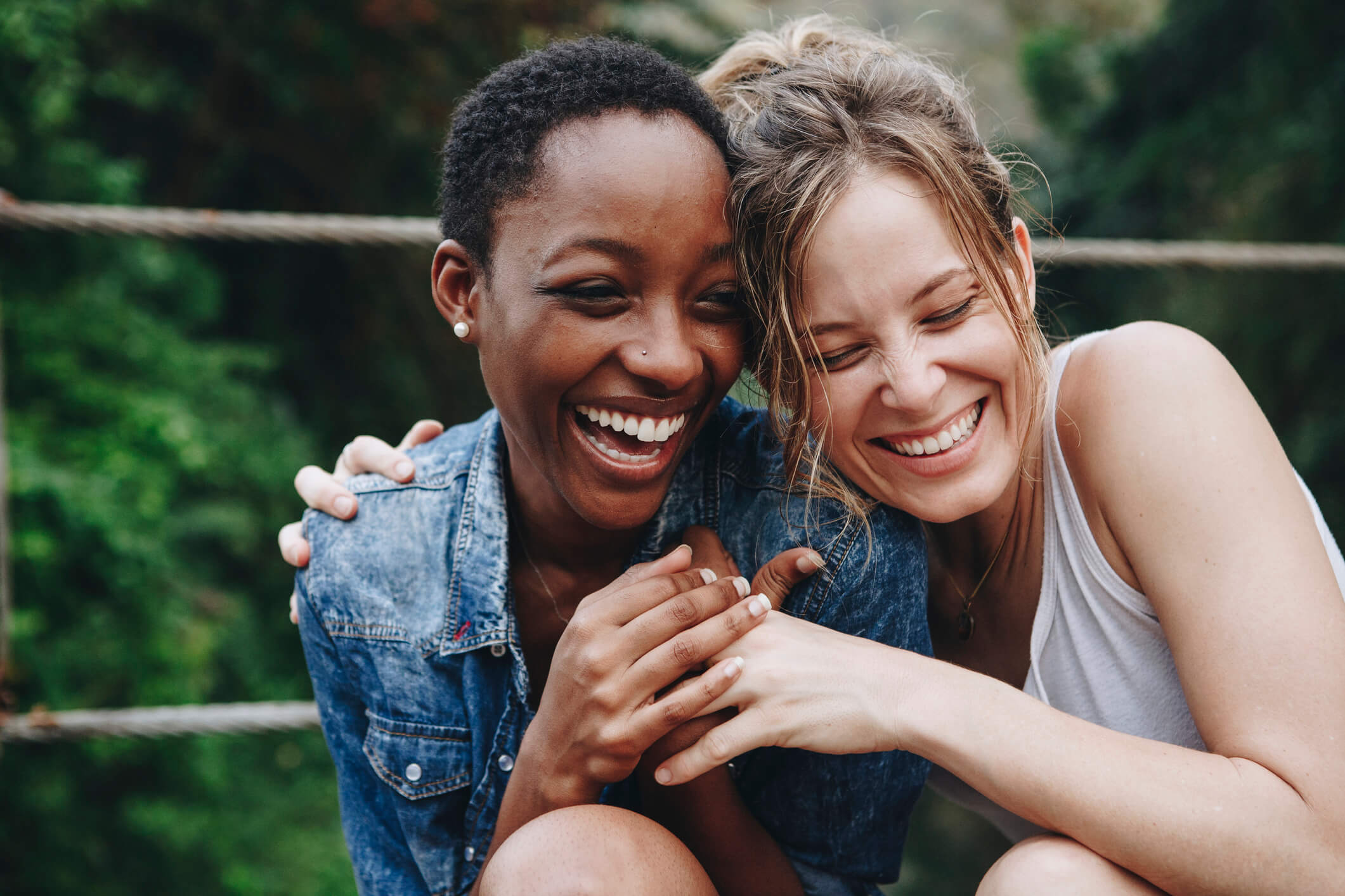 A woman hugs her friend after she offers to be her surrogate. The cost of using a friend as a surrogate can help families.